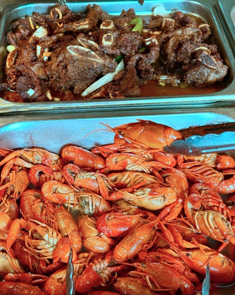 Hibachi beef and a tray of crawfish