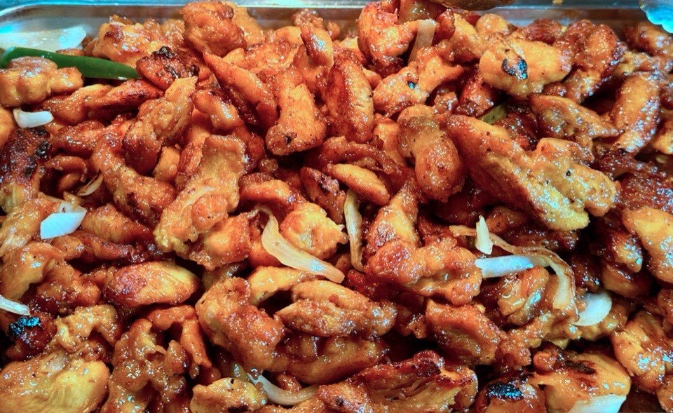 Close-up of chicken with onions and peppers