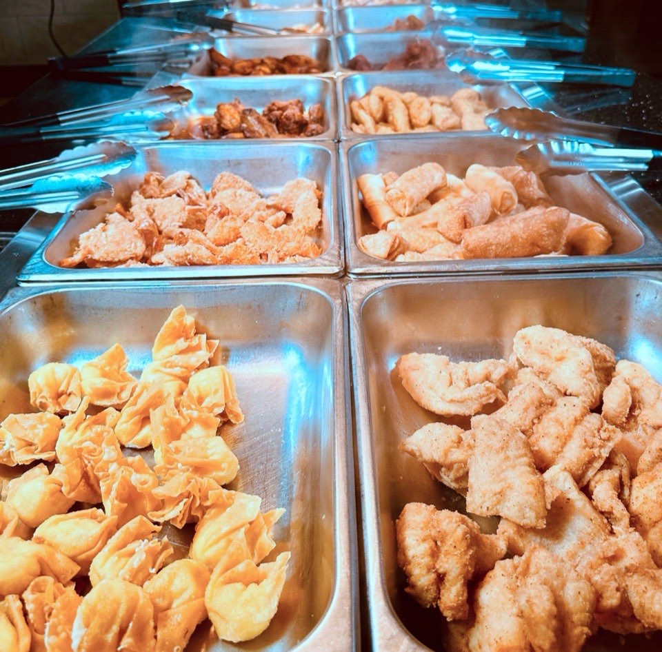 Fried dumplings and fried fish on the buffet line