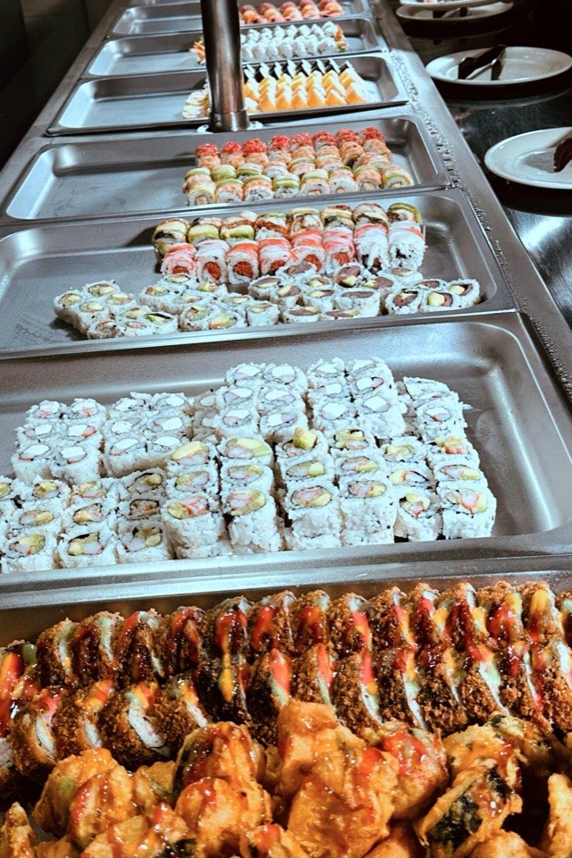 Rows of sushi rolls on the buffet line