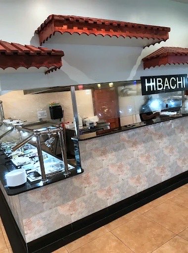 Hibachi station under its red tiled-roof canopy