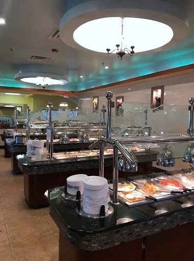 Rows of buffet trays beneath domed ceiling lights