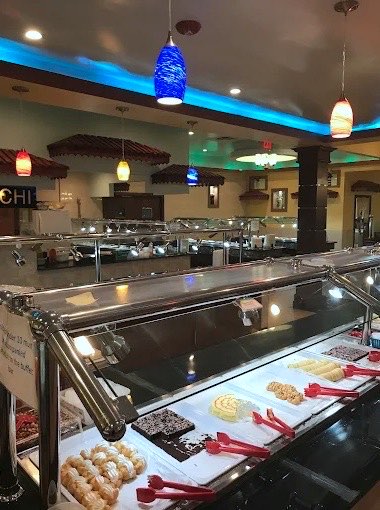 Dessert and sushi bar with colorful pendant lights