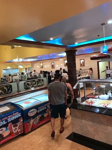 Guests walking past the ice cream freezers toward the buffet