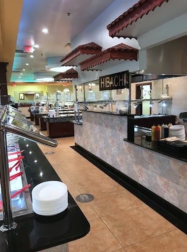 Stacked plates at the start of the buffet line